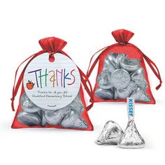 two bags filled with silver foiled candy