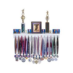 the trophy display is filled with medals and other trophies on top of a white shelf