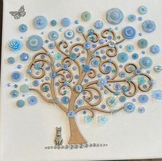 a tree made out of buttons on a white card with a cat sitting under it