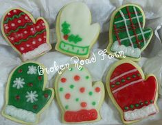 decorated cookies in the shape of mittens and gloves