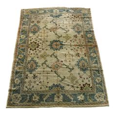 an antique rug with various colors and designs on the carpet is shown in front of a white background