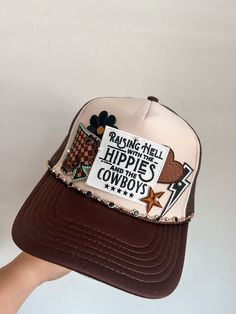 This custom made trucker patch hat is perfect for any occasion whether it be for spring/summer time, a lake hat, a gift for someone, or just a cute accessory to add a little spice to your outfit 🧢✨ DETAILS-  * This hat is one size with an adjustable SnapBack that is adjustable from 20in. - 23.5in. * The color of this hat is Tan & Brown * The material of the hat is polyester with iron on patches  REFUNDS AND CANCELLATIONS- Every hat is handmade by me as a result, a slight variation can occur from the picture with patch size or placement. If you have any problems with your hat please message me within 24 hours of receiving your order and I'd be happy to help! No refunds or exchanges will be accepted after. NOTICE OF NON-AFFILIATION AND DISCLAIMER: We are not affiliated, associated, authoriz Summer Trucker Hat With 5-panel Design, Summer Trucker Hat 5-panel, Summer Trucker Hat 5-panel Style, Trucker Hat With Curved Brim For Country Events, Summer Trucker Hat In 5-panel Style, Festival Trucker Hat Snapback, One Size, Festival Trucker Baseball Cap With Curved Brim, Trucker Baseball Cap With Flat Brim For Festival, One Size Fits Most Snapback Trucker Hat For Festivals