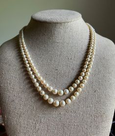 Item: Vintage Art Deco Double Strand Cultured Pearl Necklace. The clasp is sterling. Measurements: 18 & 3/4 inches long. The pearls measure between 3mm and 7mm. Condition: Vintage, previously owned. There are only very minor sings of age/use. Please see our other listings, we combine shipping for savings. Luxury Beaded Double Strand Pearl Necklace, Luxury Double Strand Pearl Drop Necklace, Double Strand Pearl Necklace, Vintage Pearl Necklace, Pearl Necklace Vintage, Cultured Pearl Necklace, Halloween 2024, Princess Margaret, Black And White Dress