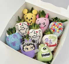 a box filled with lots of different decorated rocks in it's sides and faces