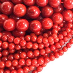 some red beads are arranged on top of each other