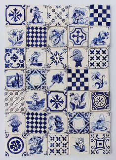 blue and white tiles are arranged in rows on the wall, with different designs all over them