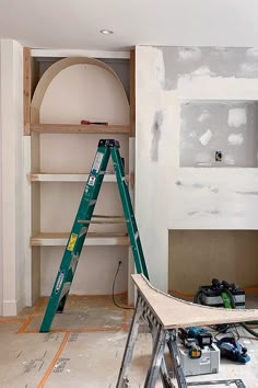 a room that is being remodeled with some tools on the floor and ladders in front of it