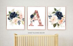 three floral wall art prints hanging above a crib