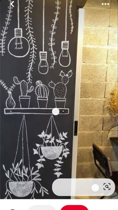 a chalkboard with plants drawn on it