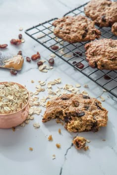 cookies, oatmeal and peanut butter are on cooling racks next to each other