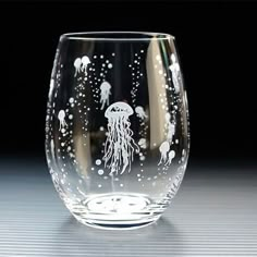 a clear glass with some jellyfish on it