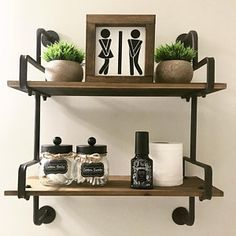 two shelves with various items on them in the bathroom, one shelf is holding toiletries and the other has a potted plant