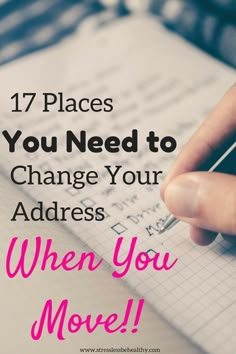 someone writing on a notebook with the words 17 places you need to change your address when you move