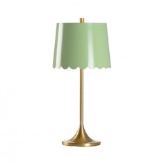 a green lamp with a gold base and a white shade on the top of it