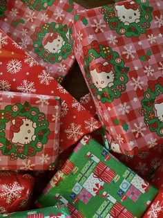 many wrapped presents with hello kitty designs on them