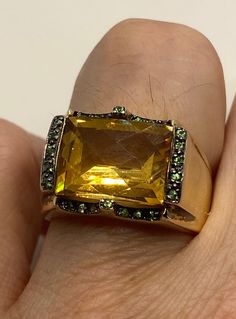 Vintage golden citrine and green chrome diopside 925 sterling silver cocktail ring Unusual cut of citrine in 925 sterling silver setting Handmade Size 7 Can be resized, my jeweler charges $10-$20 All rings are shipped in a nice gift box. Check out our over a THOUSAND great reviews Engraving is $4 per letter and is not always perfect depending on the piece. It can take a few days if the jeweler is busy. This is payable to Paypal Judithsltd@gmail.com Green Multi-stone Topaz Ring For Formal Occasions, Formal Green Multi-stone Topaz Ring, Oval Citrine Green Jewelry, Oval Green Citrine Jewelry, Formal Yellow Multi-stone Jewelry, Gold Crystal Ring For Formal Occasions In May, Gold Crystal Ring For May Birthstone Formal Occasion, Gold Crystal Ring For May Birthstone Events, Elegant Green Citrine Jewelry