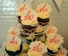 cupcakes are arranged on a cake stand