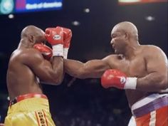 two professional boxing players in the ring during a match