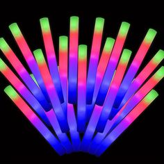 glow sticks are arranged in the shape of an arrow