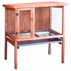 a large wooden bird cage with two doors and one door open on the top shelf