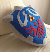 a blue and white pillow with an image of the legend of zelda on it