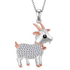 a silver goat with pink and white crystals on it's face, standing in front of a white background