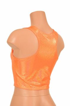 "This item is made to order, please read all the way through the listing before purchasing! This sizzling hot orange holographic crop top has an amazing rainbow shine! It features a scoop neckline in front and an edgy racerback design in the back. It is made of four way stretch lycra spandex, and it fits like a glove! Super figure flaunting and fun! This top is just perfect when paired with any of our bike shorts or high waist leggings for a sporty look. LENGTH: 8\" (from the underarm to the hem Summer Stretch Dancewear Crop Top, Stretch Summer Dancewear Crop Top, Stretch Dancewear Crop Top For Summer, Stretch Crop Top For Summer Dancewear, Orange Stretch Tank Top For Party, Stretch Orange Tank Top For Party, Orange Stretch Crop Top, Fitted Summer Tops For Dancewear, Stretch Orange Cropped Top