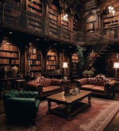 a living room filled with lots of furniture and bookshelves in front of a spiral staircase