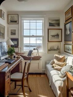 a living room filled with furniture and pictures on the wall above a computer desk in front of a window