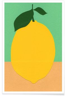 a paper cut out of a lemon on a green background