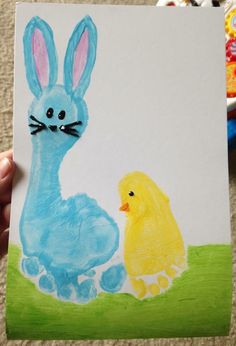 a child's drawing of a blue bunny and yellow duck sitting next to each other