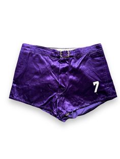 Vintage 1950's Era athletic shorts in a beautiful purple satin fabric. Still in great condition, a perfect fashion statement next time you hit the courts. Marked Size: 30 Waist: 29" Hips: 40" Rise: 10.5" Inseam: 2.5" Item is for sale at Barn Owl Vintage Goods in Georgetown. Seattle's Home for Vintage Athletic Shorts!  Every attempt has been made to document every flaw, but we are, alas, human so there exists the possibility we have not gotten everything.  All sales are final.  No refunds or exchanges. Seattle Homes, Purple Satin, Barn Owl, Athletic Shorts, Vintage 1950s, Satin Fabric, Short Outfits, Fashion Statement, Seattle