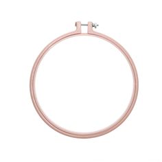 a close up of a pink ring on a white background