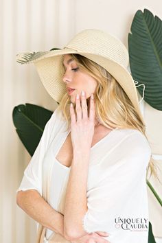 Take your vacay or weekend getaway up a notch with our Palm Beach Floppy Sun Hat! Look effortlessly sophisticated with this stunning sun hat that is composed of woven straw that shapes a high crown, a rounded top, and a wide, floppy brim (that can be shaped any way you wanna wear it!) with a knotted bow accent at the band. 6" brim. 22.5" interior circumference with an adjustable internal drawstring. Crown measures 4" tall 100% Paper Spot Clean Hand Made / Hand Printed Imported