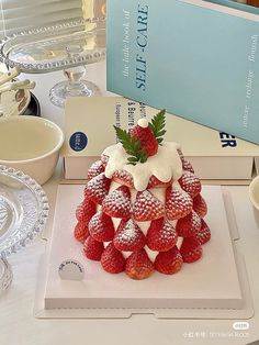 there is a cake made to look like strawberries on top of other desserts