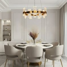 an elegant dining room with white walls and gold accents