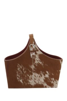 a brown and white cow print purse