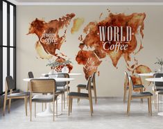 the world map is painted on the wall in an office setting with chairs and tables