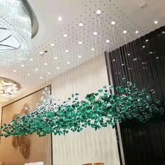 a chandelier hanging from the ceiling in a room