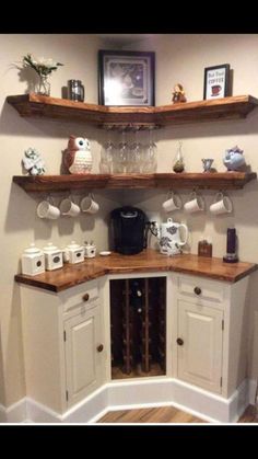 a corner cabinet with cups and mugs on it