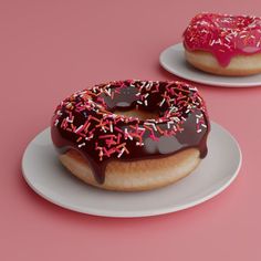 two donuts with chocolate frosting and sprinkles on plates against a pink background