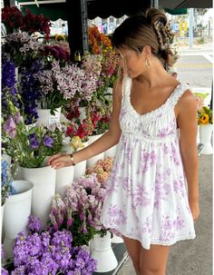 This dress features a stretchy, double-lined construction with delicate lace and ruffle embellishments on the straps, neckline, bust and bottom hem. The charming floral print and V-neck design add to the overall appeal of this must-have mini dress. Product details: Model is wearing a size small Self: 100% Cotton Lining: 100% Polyester Floral Mini Dress Outfit, Lace Trim Mini Dress, Lavender Outfit, Shabby Chic Dress, Shabby Chic Clothes, Mini Dress Outfits, Lavender Floral, Fancy Outfits, School Fashion