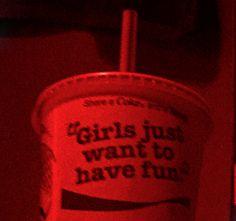 a red cup with the words girls just want to have fun on it and a straw