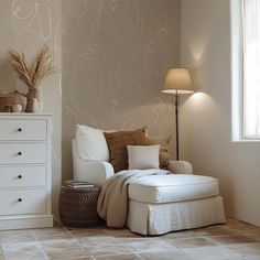 a living room with white furniture and beige walls