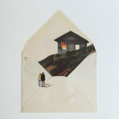 two people are standing in front of an envelope with a house on fire inside it