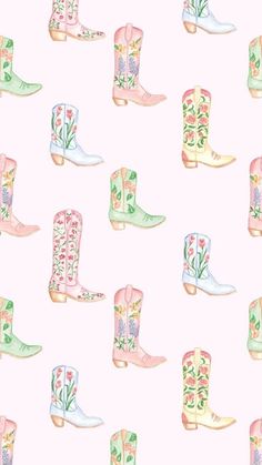 watercolor cowboy boots on a pink background with green and white florals in them