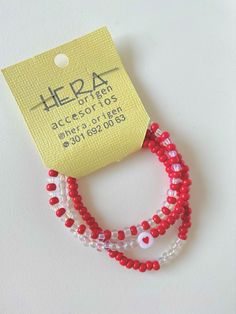 three red and white beaded bracelets with an ad for the helpa logo