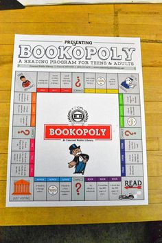 a bookoply board game sitting on top of a wooden table