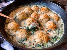 a skillet filled with meatballs covered in sauce