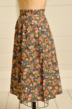 "1970s Prairie Skirt Brown & Rust Floral Bouquet Print Western Dress 70s high waisted prairie skirt. In good condition, no damage to note. Two side pockets with hidden zipper in the back. No tag or size marked. Fits like a Small, but please refer to measurements. Measurements waist: 25\" length: 29\"" Vintage Flowy Skirt For Daywear, Vintage Cotton Maxi Skirt, Vintage Long Gathered Skirt, Vintage Long Gathered Skirt Bottoms, Vintage Flowy Skirt Bottoms For Daywear, Vintage Skirt For Garden Party, Fall Vintage Maxi Skirt, Vintage Floral Print Long Maxi Skirt, Vintage Floral Print Maxi Skirt